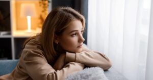 Woman thinking about why her partner isn't supporting her pregnancy